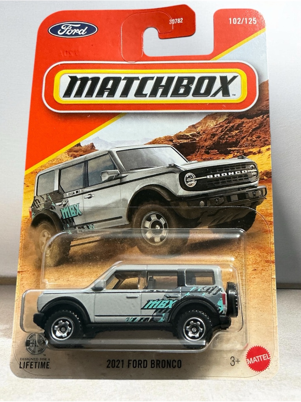 Matchbox 2021 Ford Bronco Toy SUV in Silver with Teal Graphics